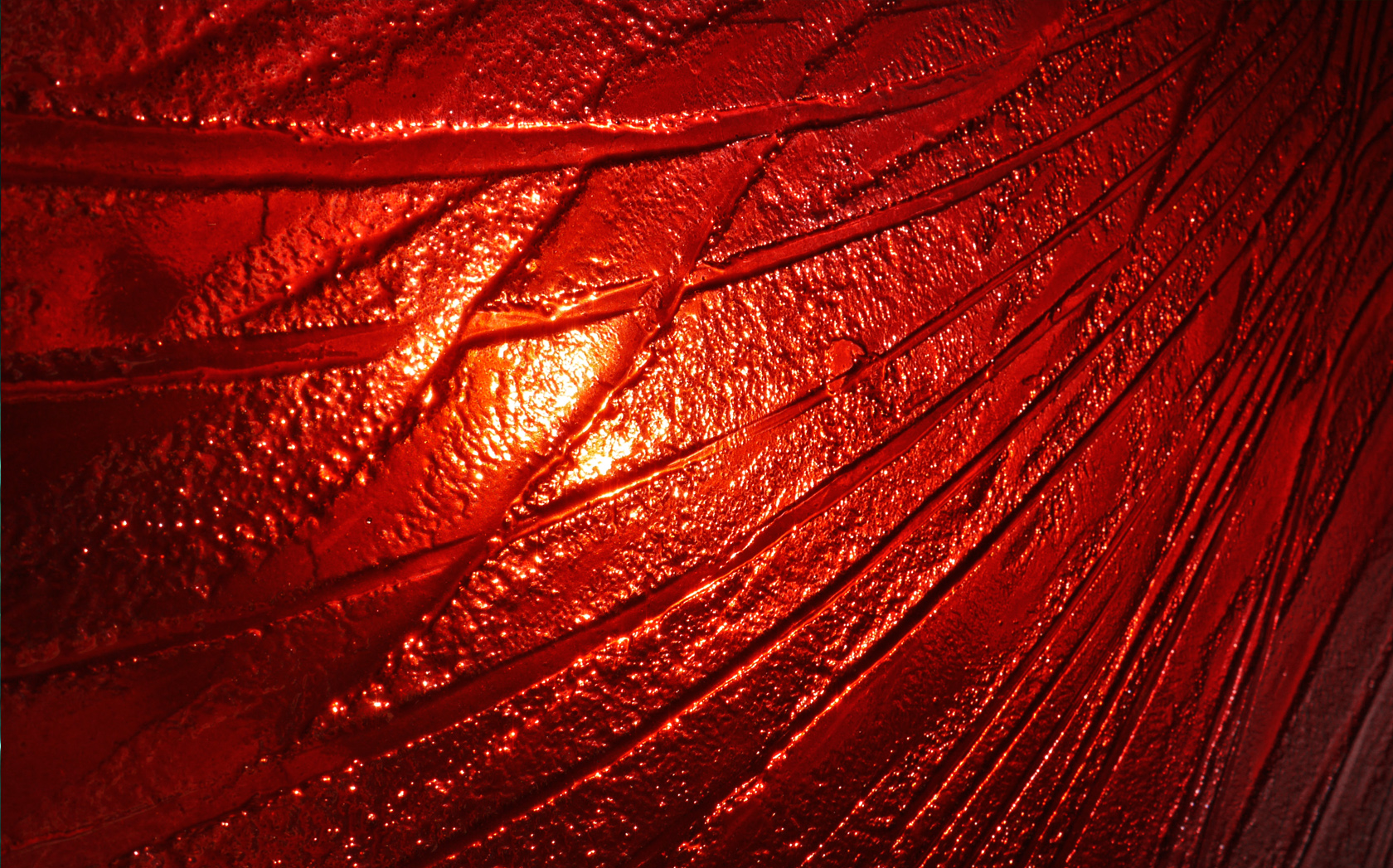 Wall Glass Art, a deep red hue shifting from burgundy to ruby kiln formed slumped glass autonomous artwork.